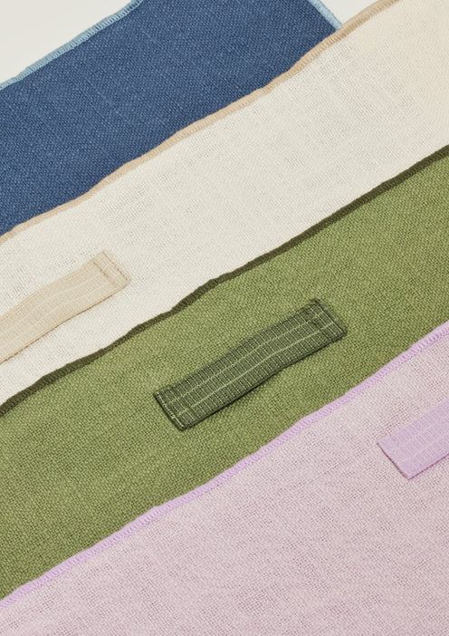 Blue, beige, green, and purple Loop Napkins up close