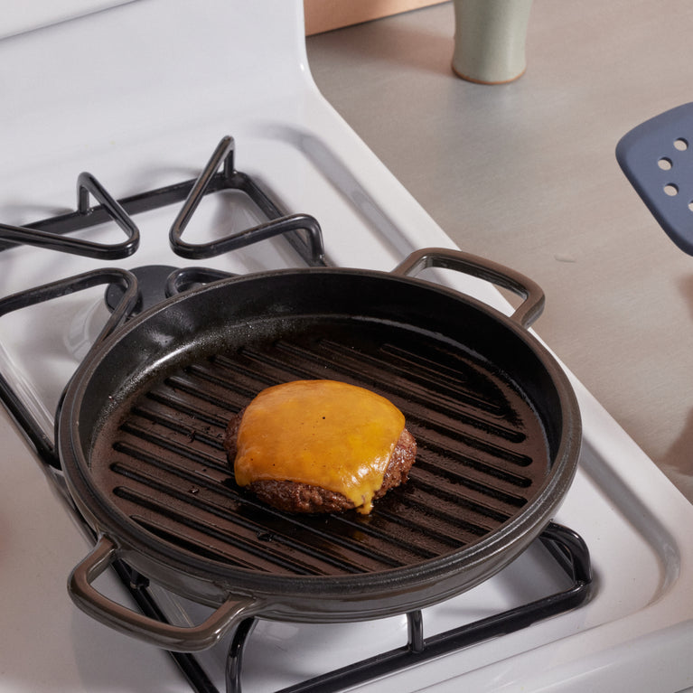Black Cast Iron Hot Grill with burger