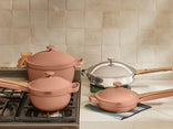 pink perfect pot, mini perfect pot on stove and pink mini always pan and chrome always pan pro on counter