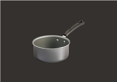 Small frying pan with a mesh strainer on a black background