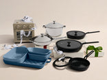 Various cookware items, including baking dishes, pots with lids, frying pans, and a toaster oven, are displayed on a light background with wrapped gifts.