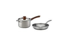 A stainless steel saucepan with a lid and brown handle is next to a stainless steel frying pan with a metal handle on a plain background.