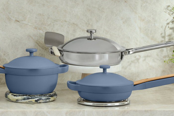 A blue pan and a blue pot on a countertop