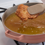 Frying chicken in a pink Large Always Pan