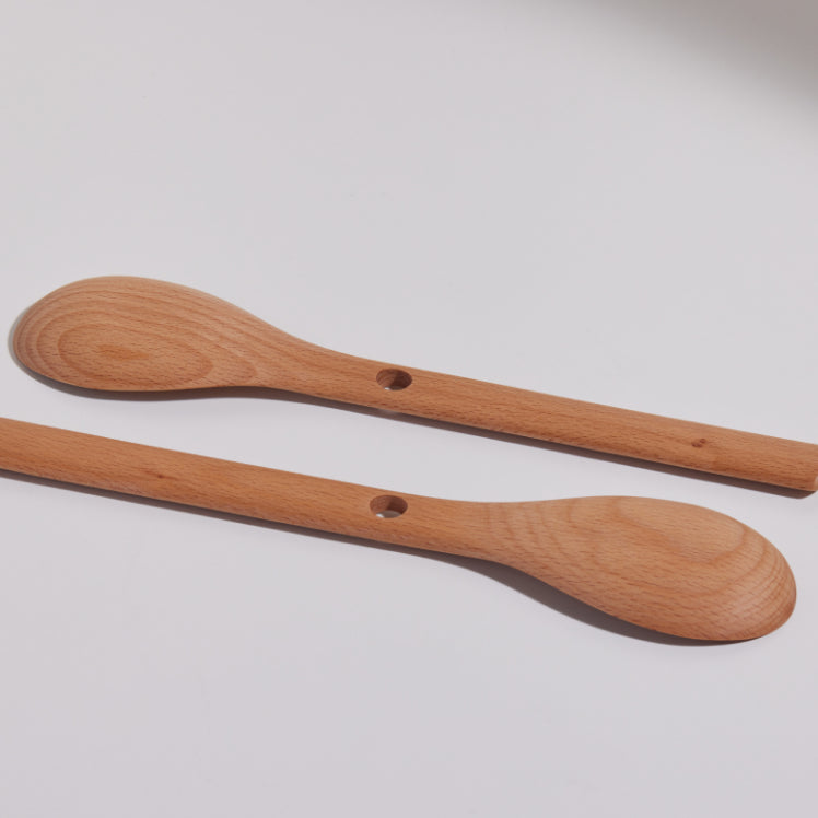 two nested beechwood spoons