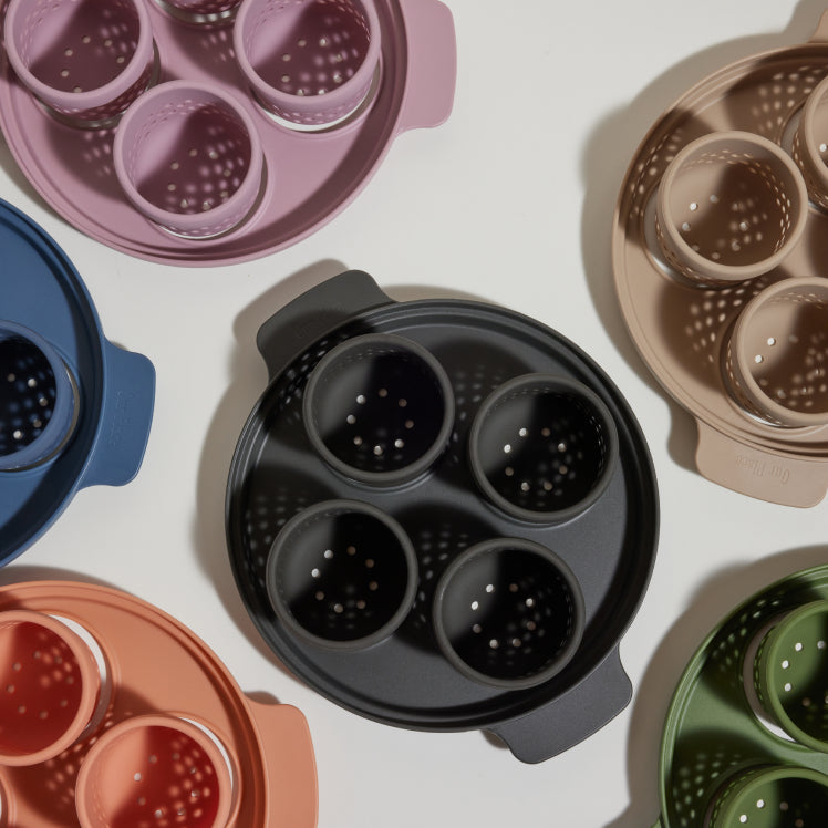 Black purple beige green blue and pink egg poacher birds eye view