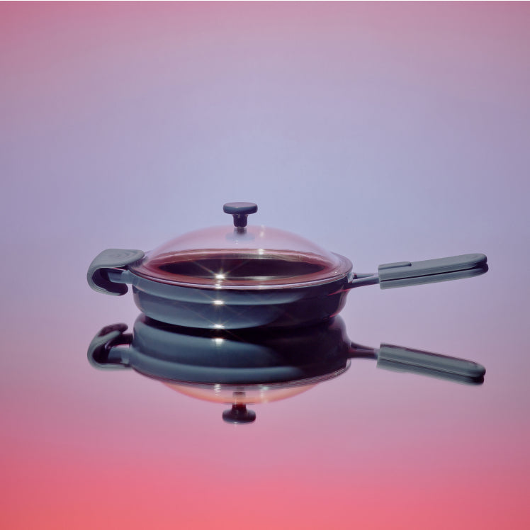 Blue Cast Iron Always Pan on reflective background