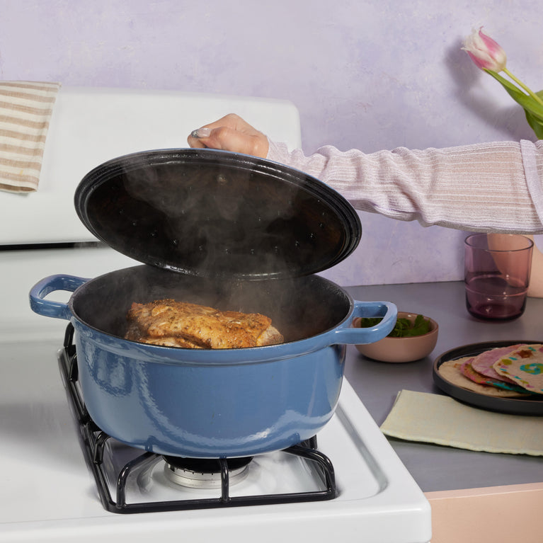 Blue Cast Iron Perfect Pot on stovetop with chicken