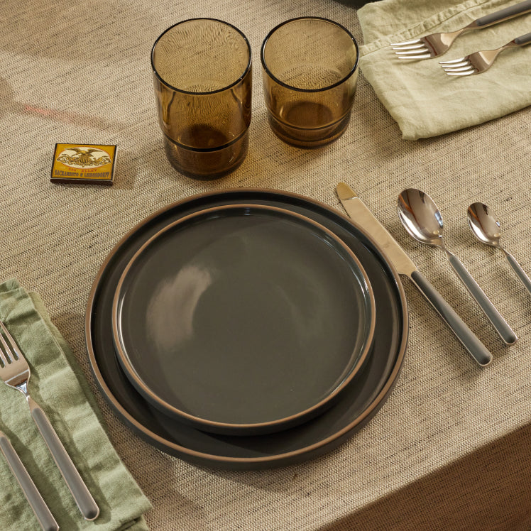 black dinnerware stacked on table