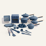 Blue kitchenware set including pots, pans, and utensils on a white background