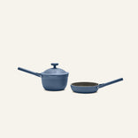 The Tiny Cookware Duo includes a blue saucepan with lid and a matching blue frying pan, both with long handles, displayed on a plain light background.