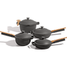 A set of five dark gray non-stick cookware pots and pans with light wood handles, arranged on a clean white background.