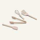 Mini Utensil Essentials: a set of four sturdy silicone tools—spatula, tongs, slotted turner, and whisk with beige handles—on a light background.