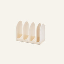Universal Storage is a beige, four-slot plastic organizer with rounded dividers—ideal for files, documents, or cookware—shown on a plain light background.