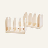 Two cream-colored Universal Storage racks, each with five slots, are placed side by side—ideal for cookware organization or adjustable storage.