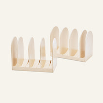 Two cream-colored Universal Storage racks, each with five slots, are placed side by side—ideal for cookware organization or adjustable storage.