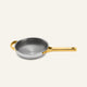 A Titanium Always Pan Pro 20 cm metal frying pan with a textured interior and gold-colored handles.
