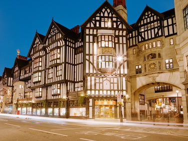 Historic building facade with illuminated windows at night