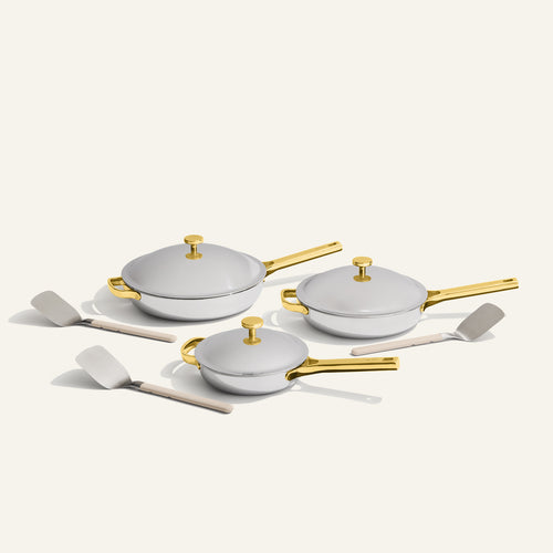 gold titanium large always pan pro, always pan pro, and mini always pan pro with stainless steel spatulas