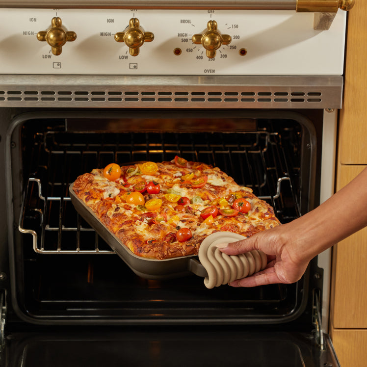 black griddle pan in oven cooking bread