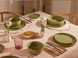 green dinnerware assortment on table