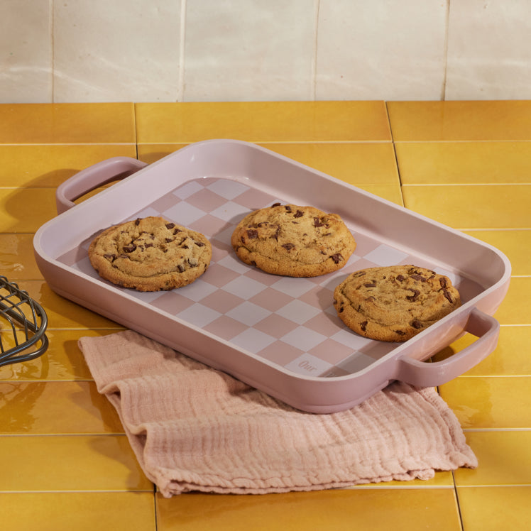 Baking cookies on a pink Mini Griddle Pan lined with a pink Mini Oven Mat