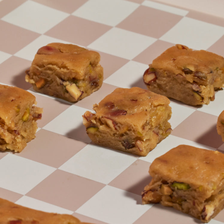 Baked treats on a pink Mini Oven Mat