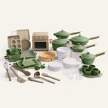 Collection of green kitchenware including pots, pans, and utensils on a white background