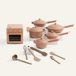 Set of ceramic cookware and kitchen tools on a white background