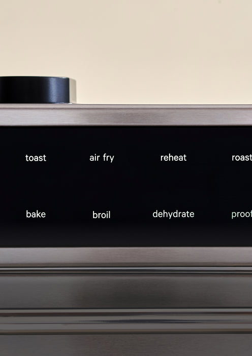 Control panel of an oven with touch settings for toast, air fry, reheat, roast, bake, broil, dehydrate, and proof.