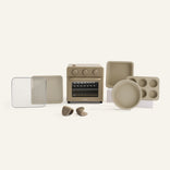Set of beige kitchen appliances and utensils on a white background