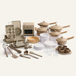 Collection of kitchenware including pots, pans, and utensils on a white background