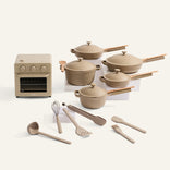 Set of beige cookware and kitchen tools on a white background